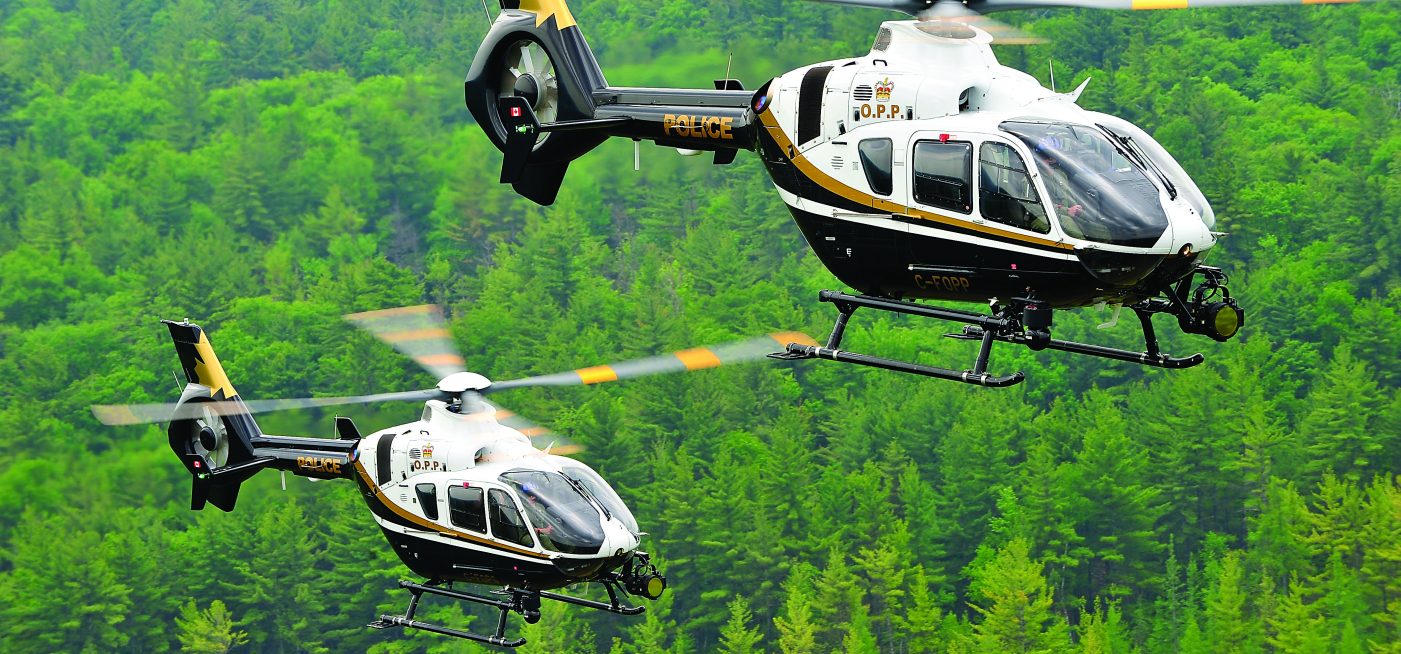 Ontario Provincial Police flies two Airbus H135 helicopters over forest in Canada