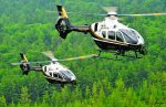 Ontario Provincial Police flies two Airbus H135 helicopters over forest in Canada